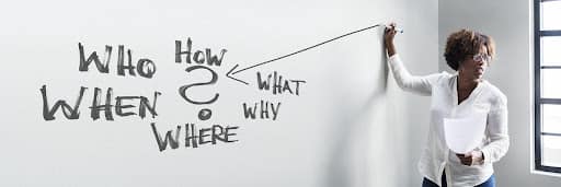 A woman drawing Who, What, When, How, where, and why on a whiteboard to represent the Why of your business in Branding. Fix and Form Strategic Branding Agency, Denver Colorado
